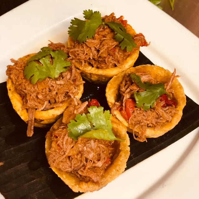 Tostones Rellenos - Plantain cups with meat.